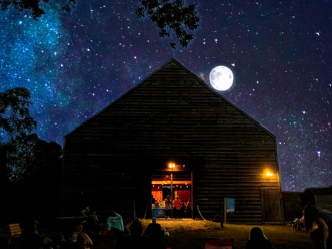 The barn illuminated during an Albany Worships evening gathering